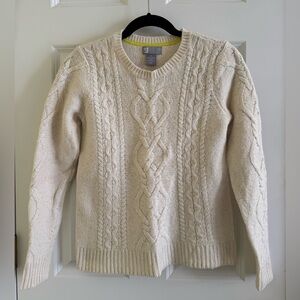 Women’s cable knit sweater.